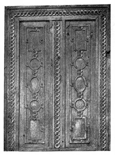 UPPER HALF OF CARVED WALNUT DOOR.